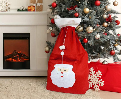 Didelis kalėdų senelio dovanų maišas dovanom dovanos po eglute