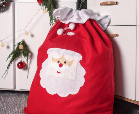 Didelis kalėdų senelio dovanų maišas dovanom dovanos po eglute